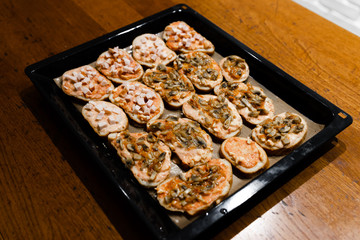 homemade hot sandwiches cooked with hands with different fillings lie in a protvin,quick sandwiches at home,fast food at home,vegetarian and meat sandwiches on one tray