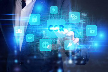 Business, Technology, Internet and network concept. Young businessman working on a virtual screen of the future and sees the inscription: CSR