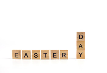 Concept image a wooden block text " EASTER DAY "  isolated on white background with copy space for text.Symbol of Christian tradition.