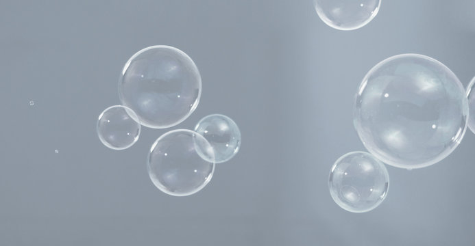 Shampoo bubbles floating like flying in the air by wind blow which represent refreshing playful or joyful moments and gentle soft comfortable and look wet and soapy for hygiene detergent product indus
