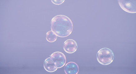 Shampoo bubbles floating like flying in the air by wind blow which represent refreshing playful or joyful moments and gentle soft comfortable and look wet and soapy for hygiene detergent product indus