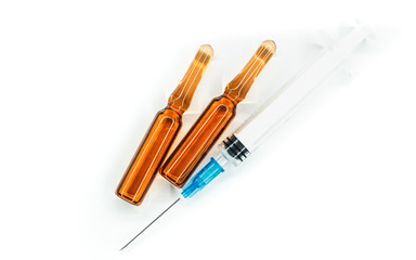 syringe with needle and two ampoules