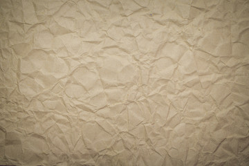 Recycled brown creased paper into the background