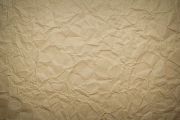 Recycled brown creased paper into the background