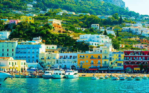 Marina with boats on Capri Island town Naples in Italy reflex