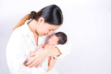 Mother day concept. The mother held the baby in her hand. Mom holding small baby. Woman hands holding newborn baby.
