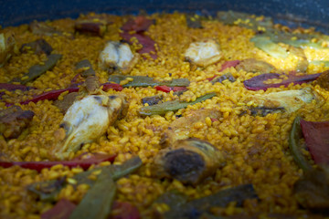 Detail of a yellow paella, Mediterranean rice from the gastronomy of Spain. close up