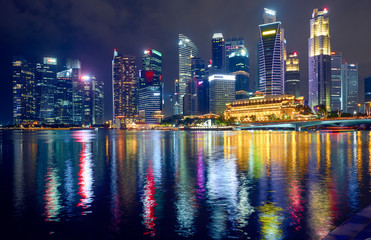 Obraz na płótnie Canvas Skyscrapers at night in Singapore.