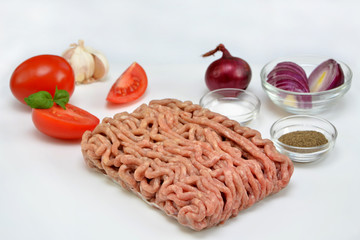 cooking ingredients minced ground meat and vegetables in the kitchen on a white background  