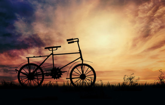Bicycle silhouette on sunset background
