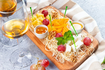 assorted cheese on a wooden background