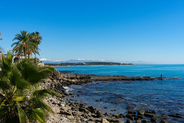 beautiful landscapes of white, green mountains and a spectacular blue sea