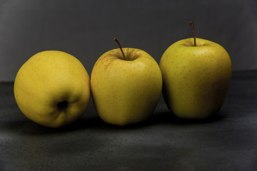 golden apples from Tyrol on metallic gray background