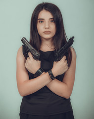 Shot of a sexy military woman posing with guns