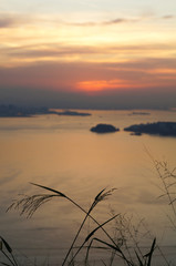 Sunset at Niteroi and Rio de Janeiro cities, Brazil. View of tourist spots in the cities, such as Guanabara Bay, Sugarloaf Cable Car, Christ the Redeemer statue