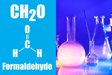 Formaldehyde on a blue background. CH2O. Chemical formula. Reagents on the laboratory desk. Test...