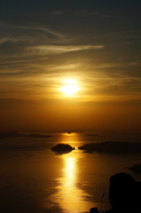 Sunset at Niteroi and Rio de Janeiro cities, Brazil. View of tourist spots in the cities, such as Guanabara Bay, Sugarloaf Cable Car, Christ the Redeemer statue