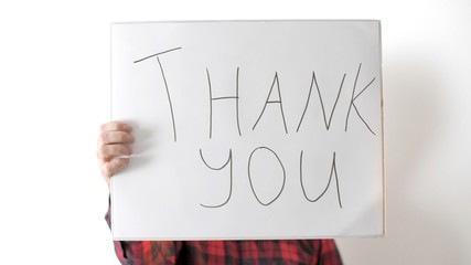 Adult guy or attractive man holding a sign saying 