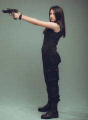 Shot of a sexy military woman posing with guns