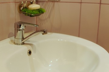Washbasin in the washroom for cleaning hands and face. Daily routine