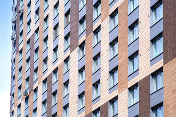 New facade of a modern residential complex. The urban background. Modern city. Modern style. Home facade. Family house.