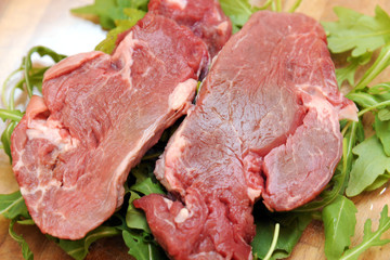 beef  raw fillet meat  on rocket salad 