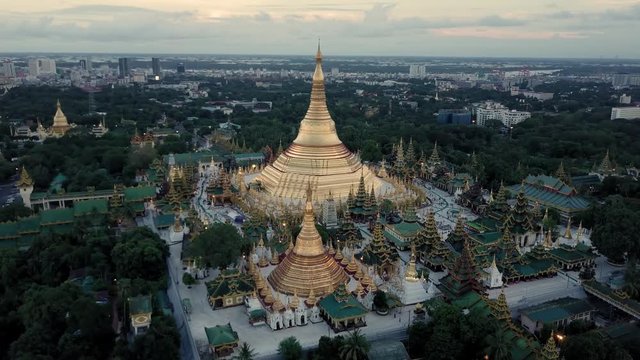 Yangon (Shwedagon pagoda) at sunset by drone in 4K. Right to left rotative shoot.