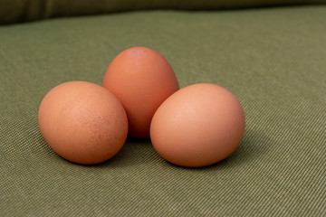 three organic eggs