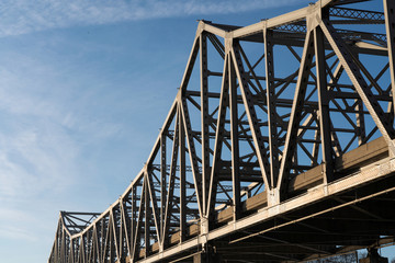 Fototapeta premium Close up of Metal Bridge Trestles of the Supply Chain and Blue Sky with Copy Space 