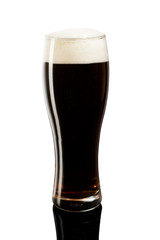 cold dark beer in glass on white background
