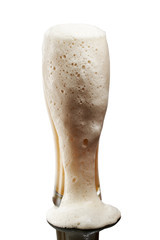 cold beer in glass with foam on white background