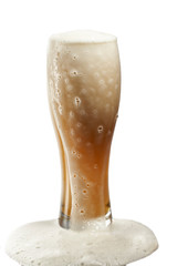 cold beer in glass with foam on white background