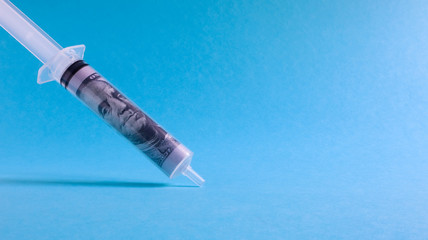 syringe on blue background