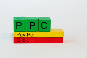 PPC is the abbreviation of Pay Per Click and stands on colorful toy blocks isolated against a white background