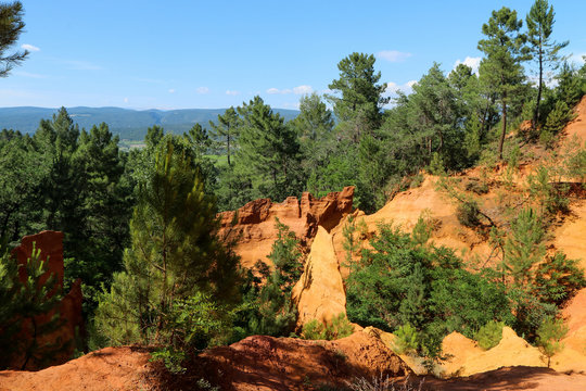The nice yellow and red sandstone rocks by Roussillon in France. The nice natural sight and tourist attraction. 