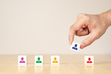 Asian businessman's hand with wooden concept of re-organized and skill of employee structure,...
