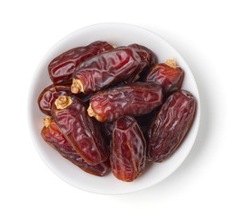 Bowl of dates isolated on white, from above