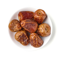 Bowl of dates isolated on white, from above