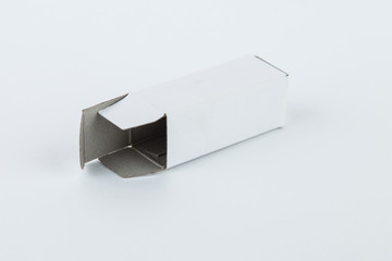 Close up of a small white cardboard box , isolated on white background