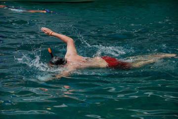 Man with mask snorkeling in sea water at Krabi province ,Thailand