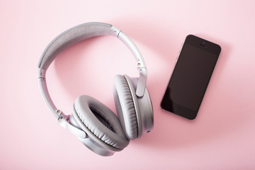 audiobook concept modern wireless headphones smartphone