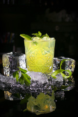 Fresh cocktail drink on dark background
