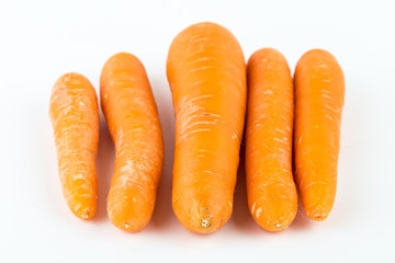 Fresh orange carrot isolated on white background.