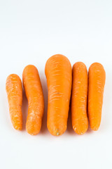 Fresh orange carrot isolated on white background.