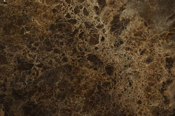 A slab with a texture of natural brown marble with a beautiful pattern, called Emperador Dark