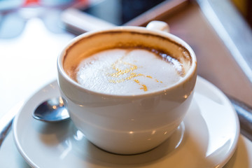 Cup of cappuccino in the cafe