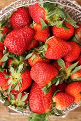 Delicious fresh strawberries on a wooden table 