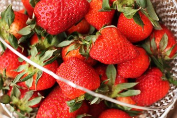 Delicious fresh strawberries on a wooden table 