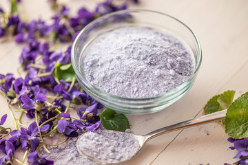 close up lilac sweet sugar crystals bath salts from fresh viola violet violetta odorata blossom flowers 
