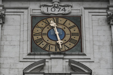 Clock tower with detailed view to the church clock at the dome of Saint Stephan